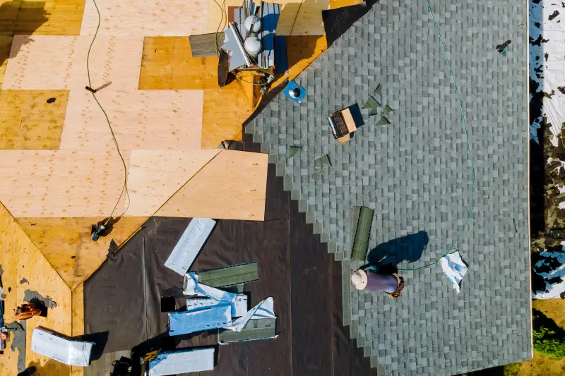 Roof repairs were carried out on apartment building, involving replacement of old roof with new shingles